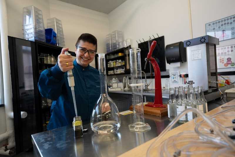 Photo of a person performing quality tests in a laboratory setting