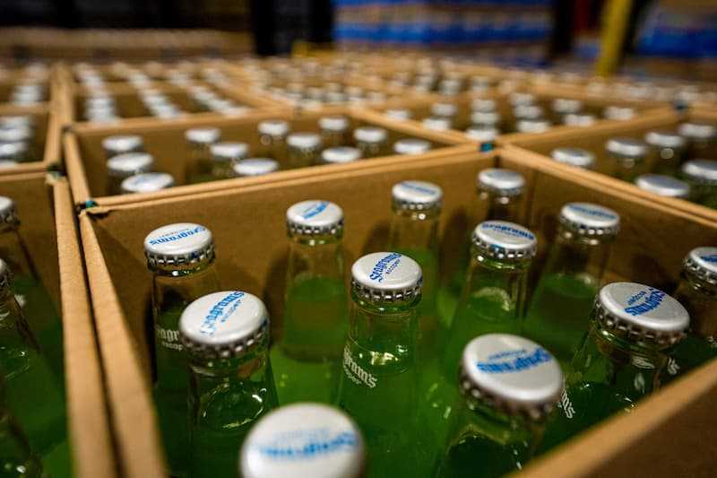 Close up photo of cased glass bottles filled with product