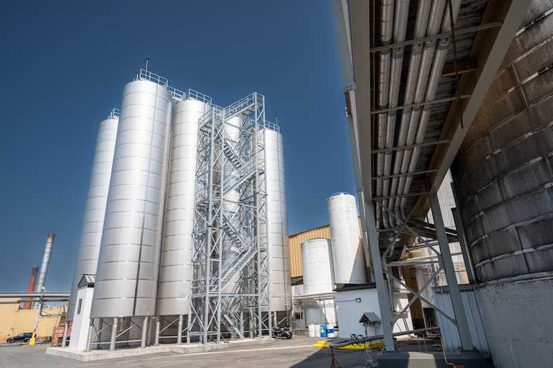 Photo of tall, external liquid storage tanks